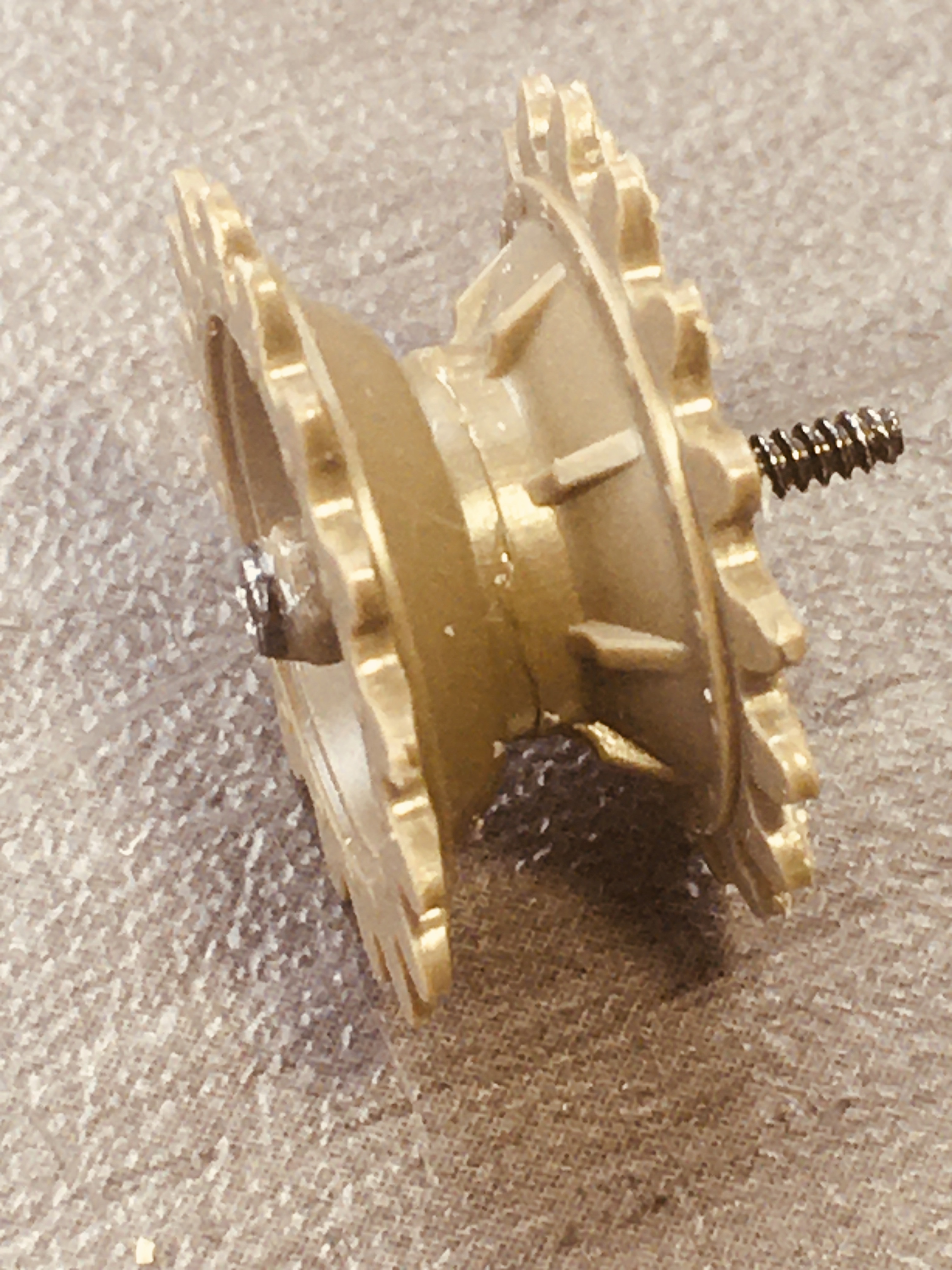 The T97 has drive sprockets that are offset to the ouside more than most so a long screw is required.