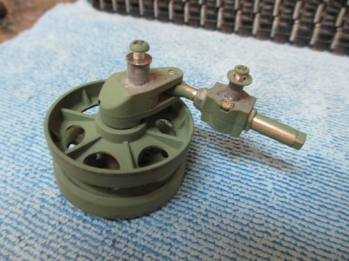 Working metal idler wheel adjuster