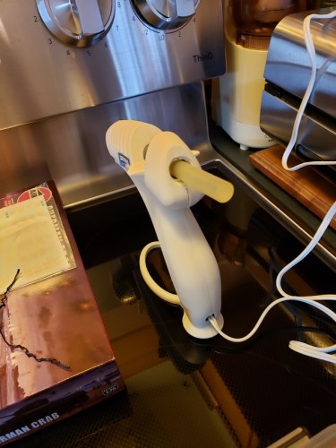 A little hot glue to hold the MG in place internally.jpg