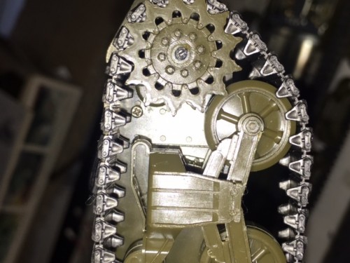 Micro mounting screw shown just aft of the drive sprocket. Gearbox can pivot on this axis and can be used as track tensioner or as is for dynamic track tension dependent on load.
