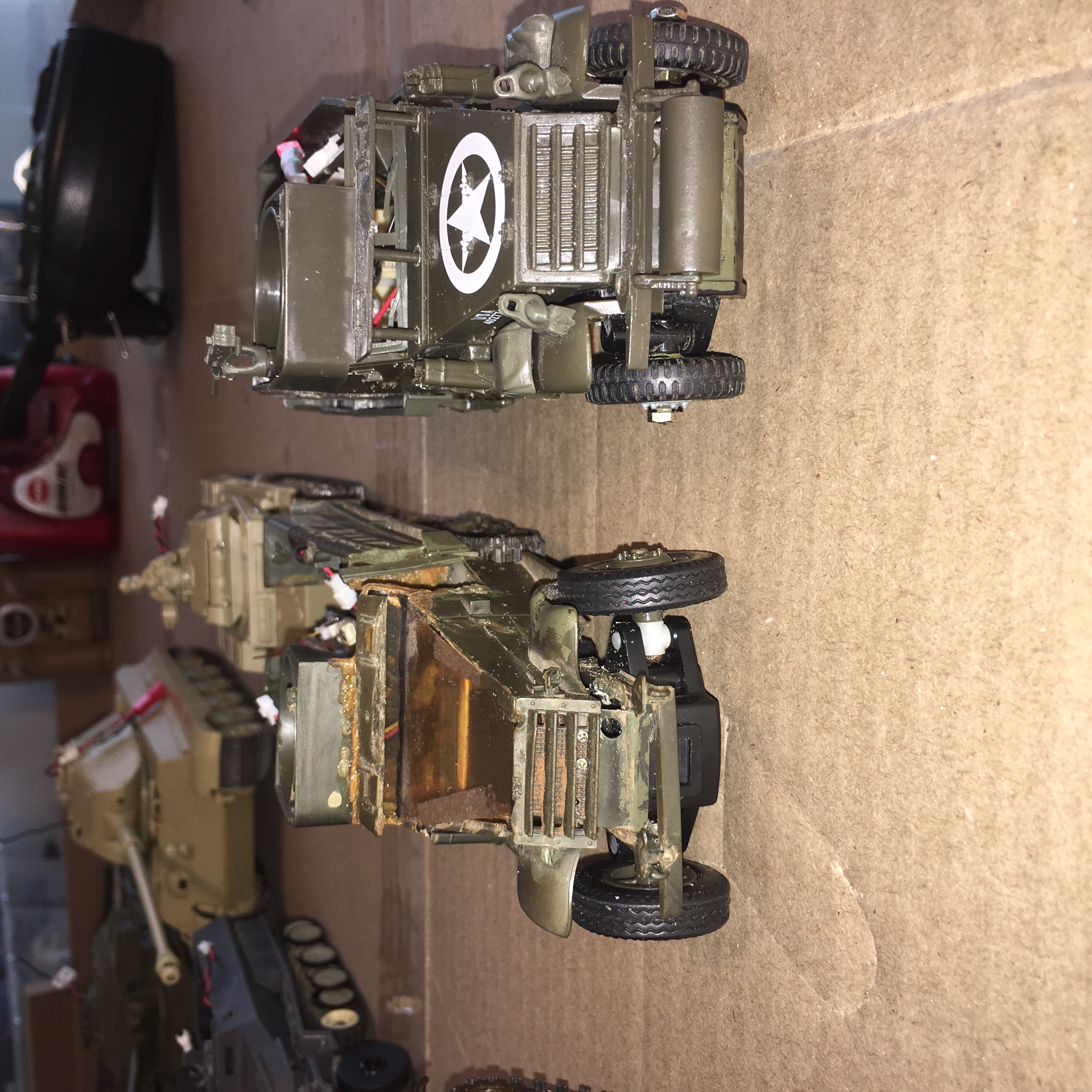 Model on the Left is a Tamiya M2A1, Model on the Right is a Testors M2A1 Half track. Looks like the Tamiya needs a wheel alignment.