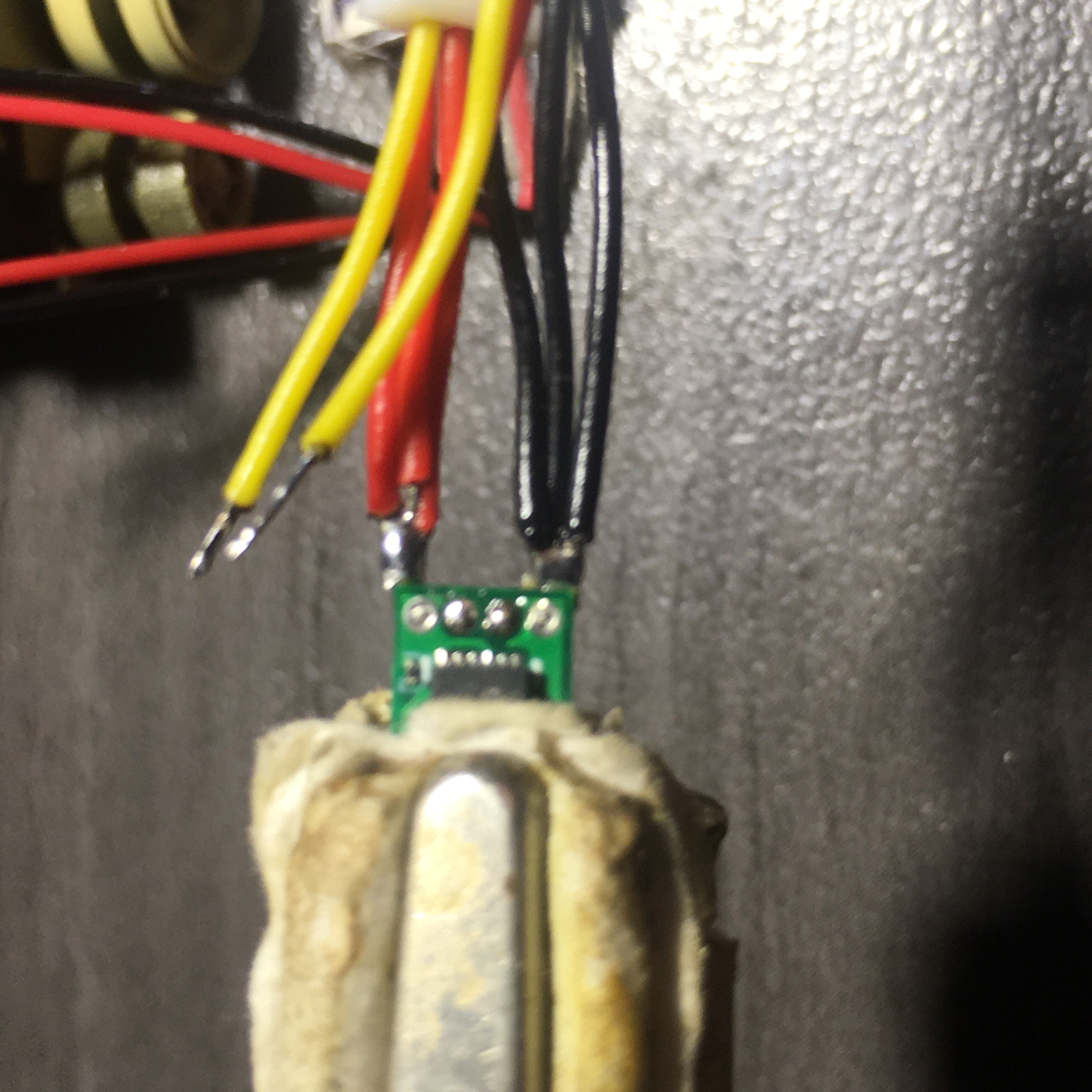 Power supply wires for the ESC and receiver (red\black) which are soldered in parallel are then soldered to the top side of the outer pads on the circuit board. The yellow wires are Aileron\Elevator output wires which go to ESC input  bottom side inner pads. These two connections are the only ones made on bottom side of the ESC circuit board.