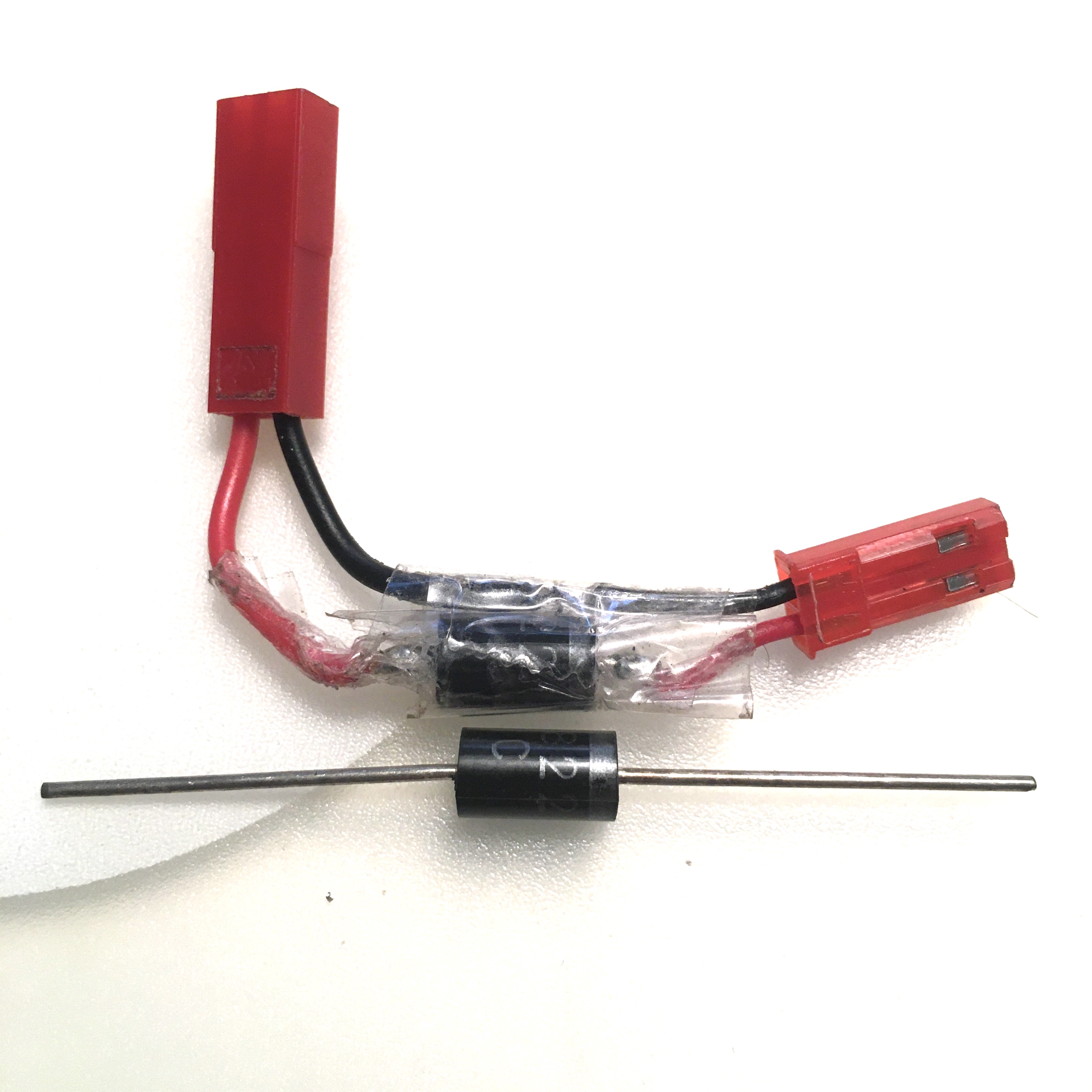 1 diode voltage drop. Anode goes to source + (Lipo RED), Cathode goes to load side -Black.