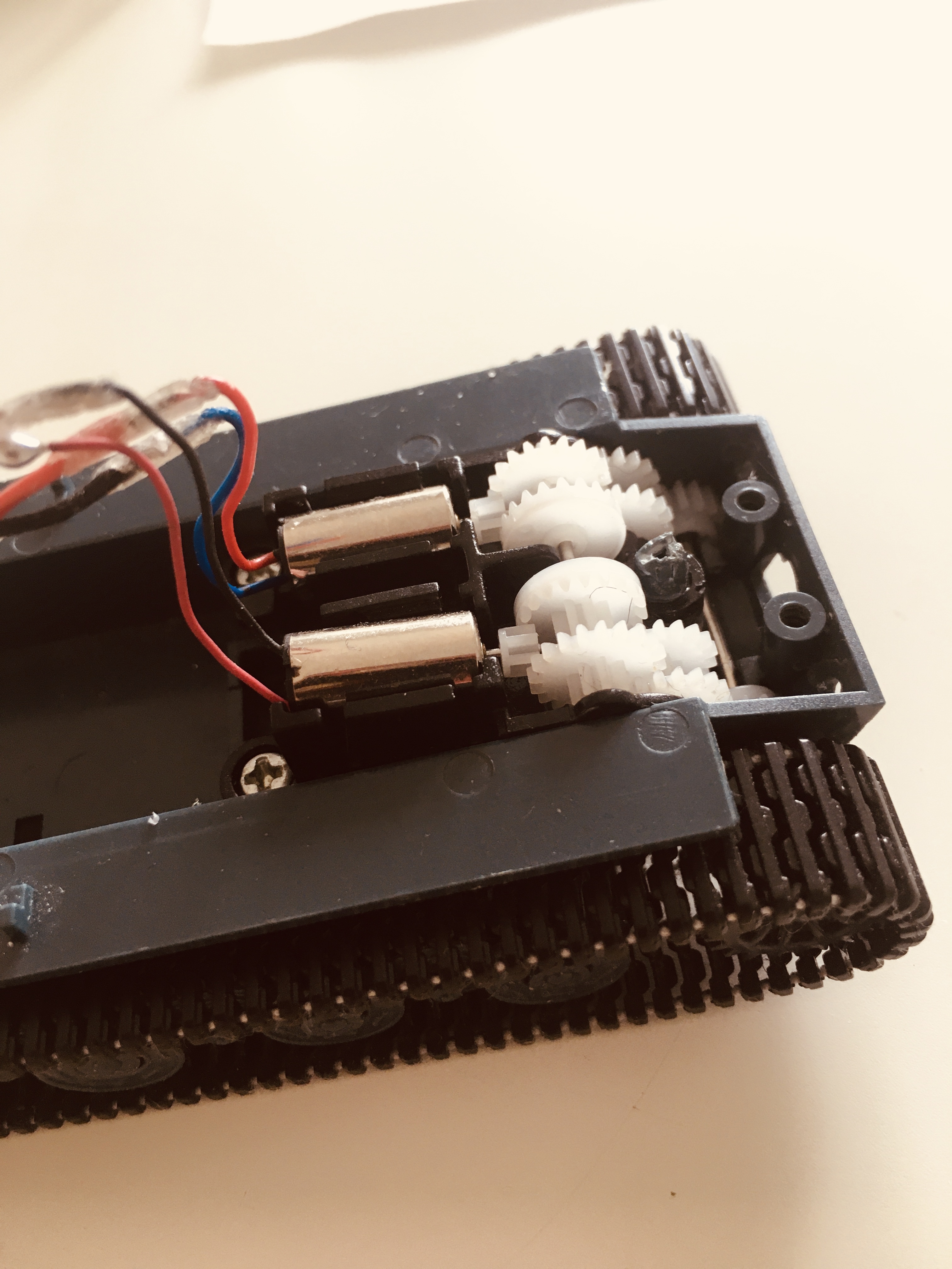 Here is an example of coreless motors with gearbox in a Tank. The motors are the same as in most coreless servos and no they do not last as long as brushed motors and generally are run at a higher RPM than standard brushed motors. If kept at higher RPM's, they seem to last a good while plus they are much smaller and use less power