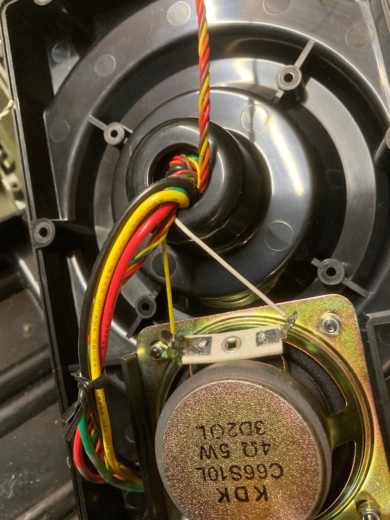 The speaker wires were tight enough to bend the mounting plate upwards