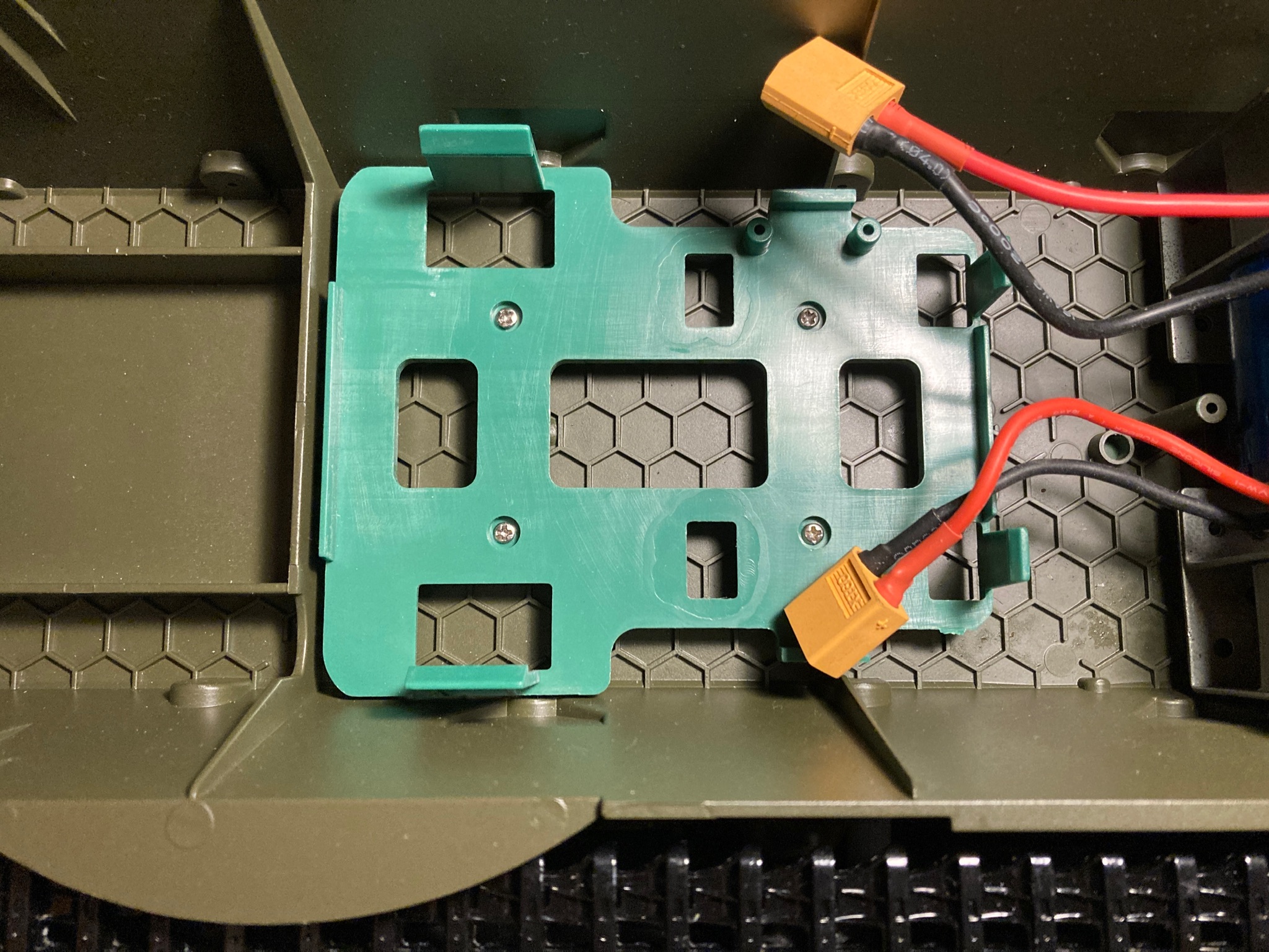 Moulded Plastic Radio Tray Screwed Into Place.