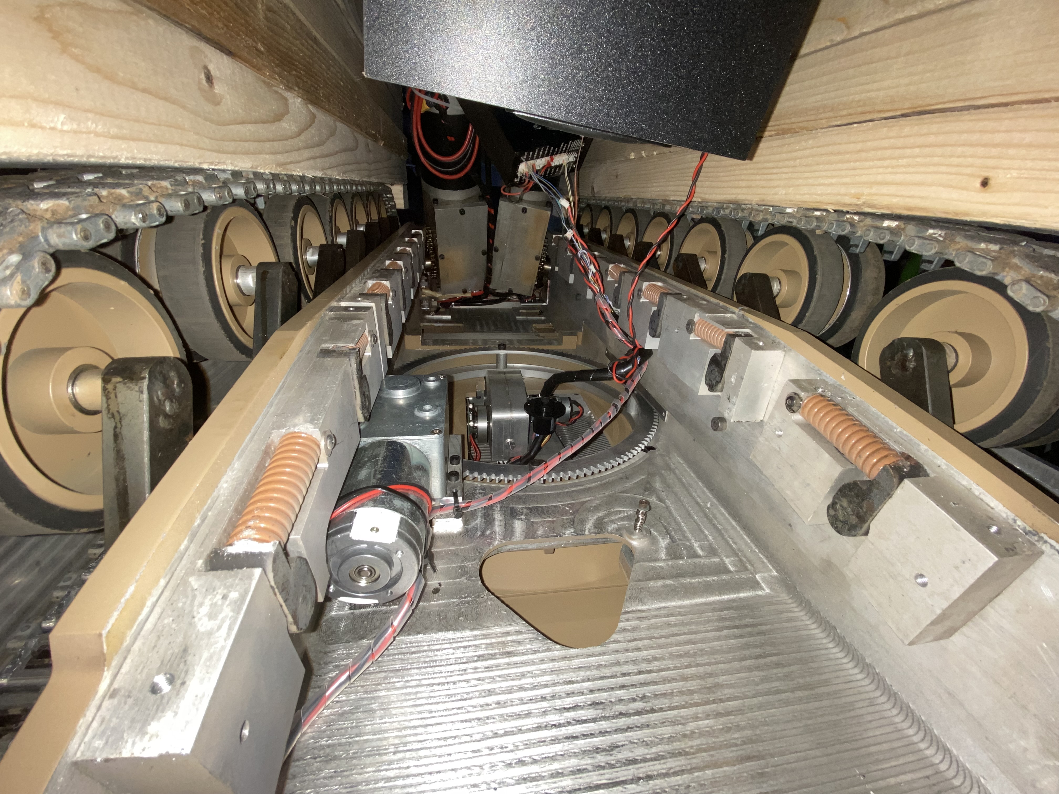 The inside, from underneath. You can see the sides look fused to the upper hull. Because of how the bottom drops out, no torsion bars. In the foreground is the travers motor, in the back the drive motors.
