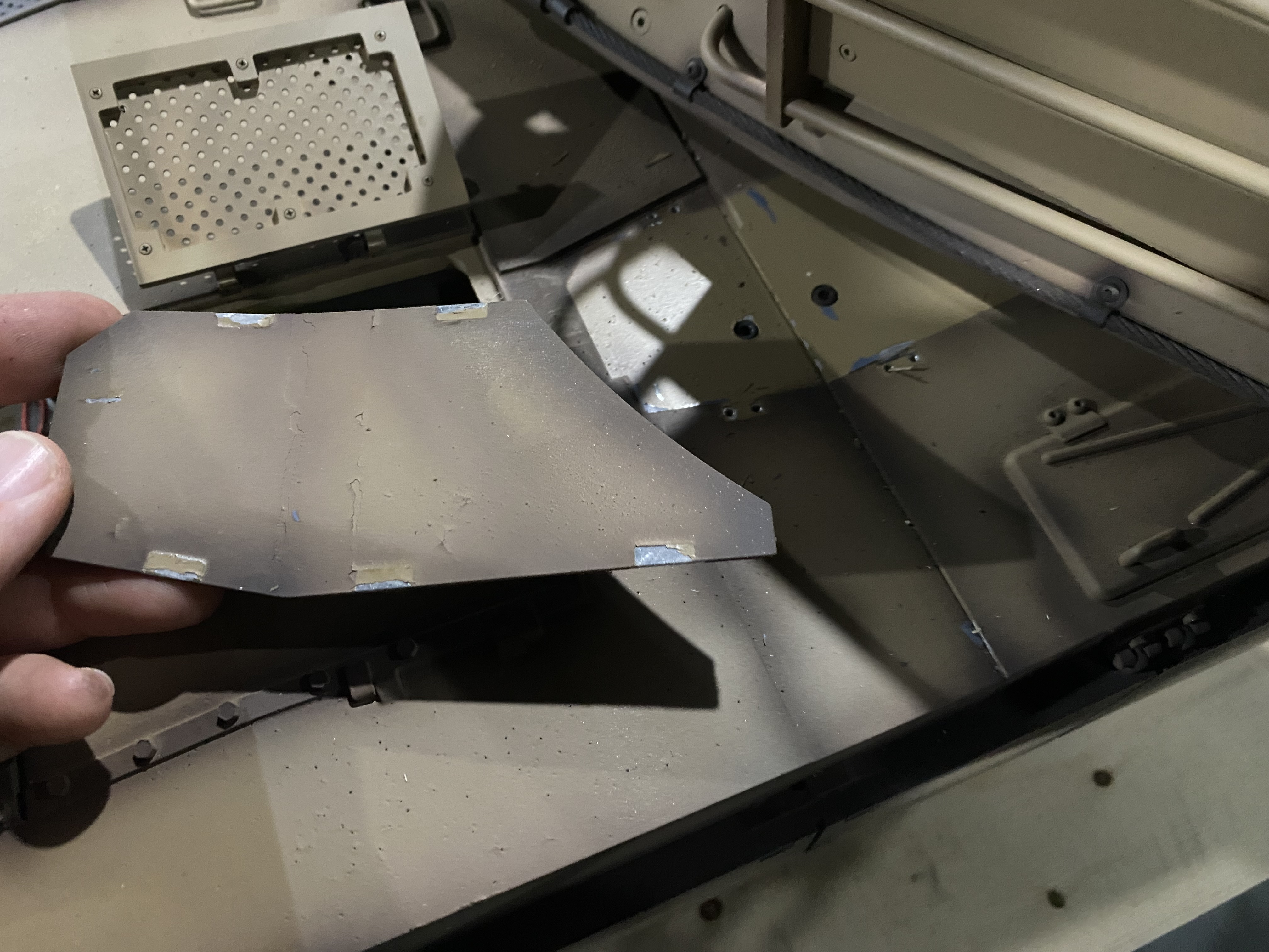 Two more screws hidden under this plate underneath the turret