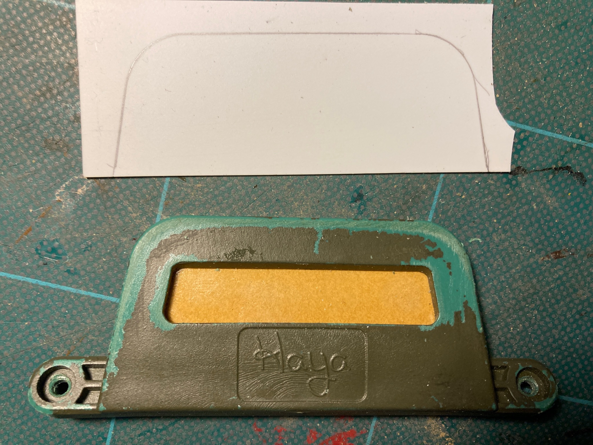 Double sided tape applied to the lower mount.