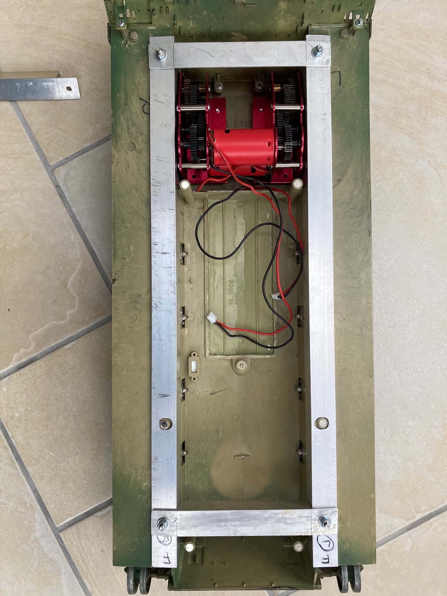 Alloy Reinforcement Frame   secured by a single 4mm screw on each corner. The proposed additional cross brace can be seen alongside.