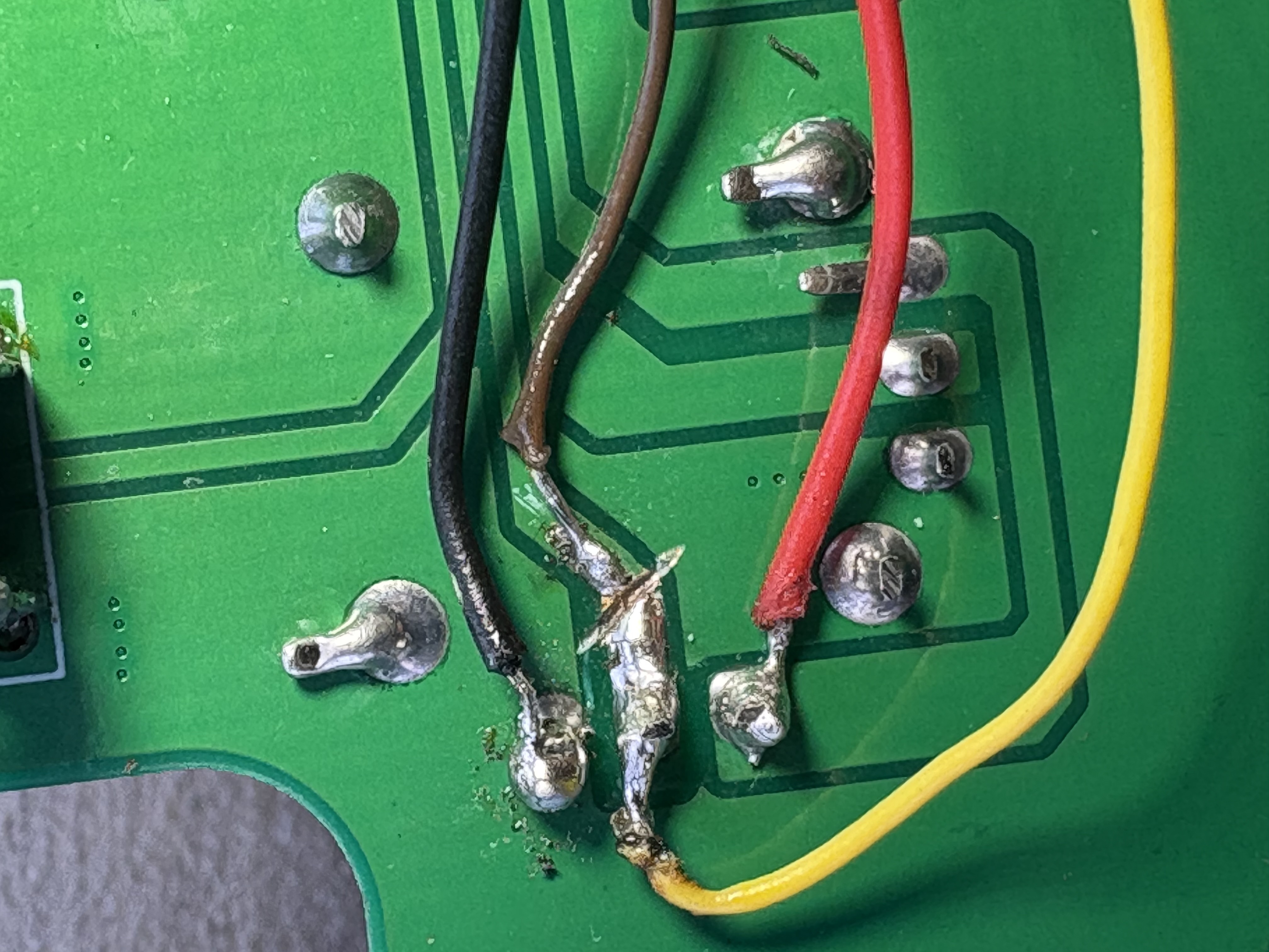Close up of circuit board wiring and modification.