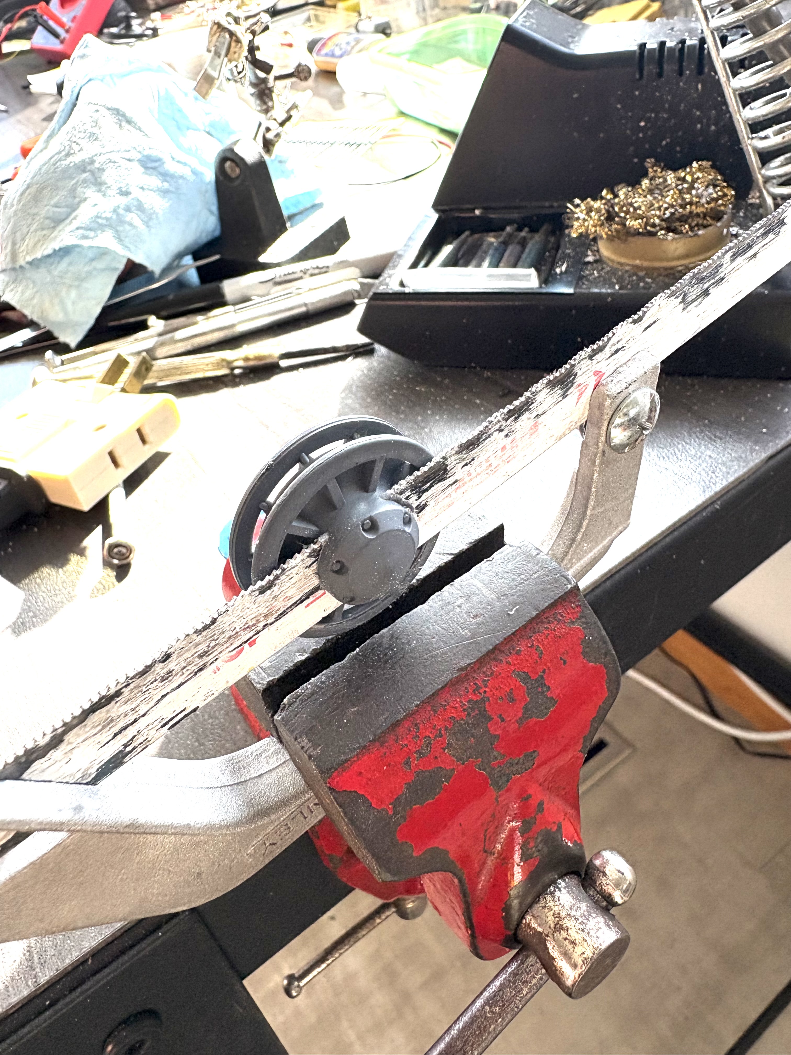 precision cutting station. This would not be possible with the idler wheel on the tank.