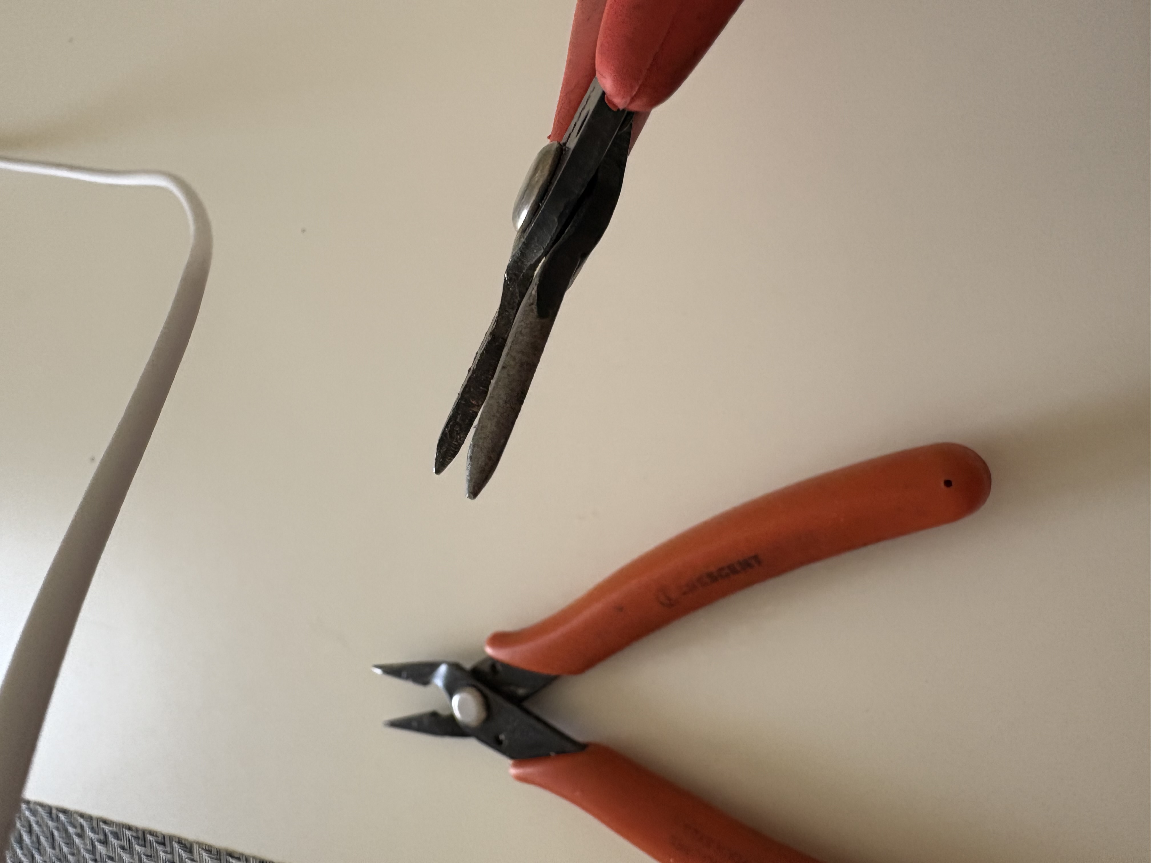 Narrow jaws. You can use them as a pair to apply a lot of concentrated force to a small area.