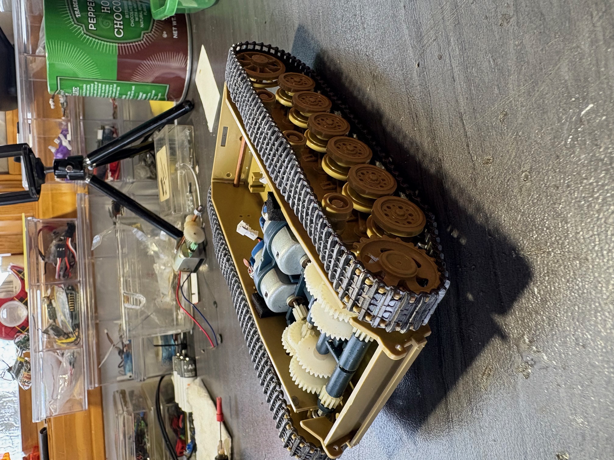 The Academy M60 gearbox and motors were a good fit with only minor mods required. Axles cut 2 mm each side. Standard Tamiya sprocket nuts fit the axles. The ones on the single motor gearbox word fine. 1 drop super glue holes them in place once proper position is found.