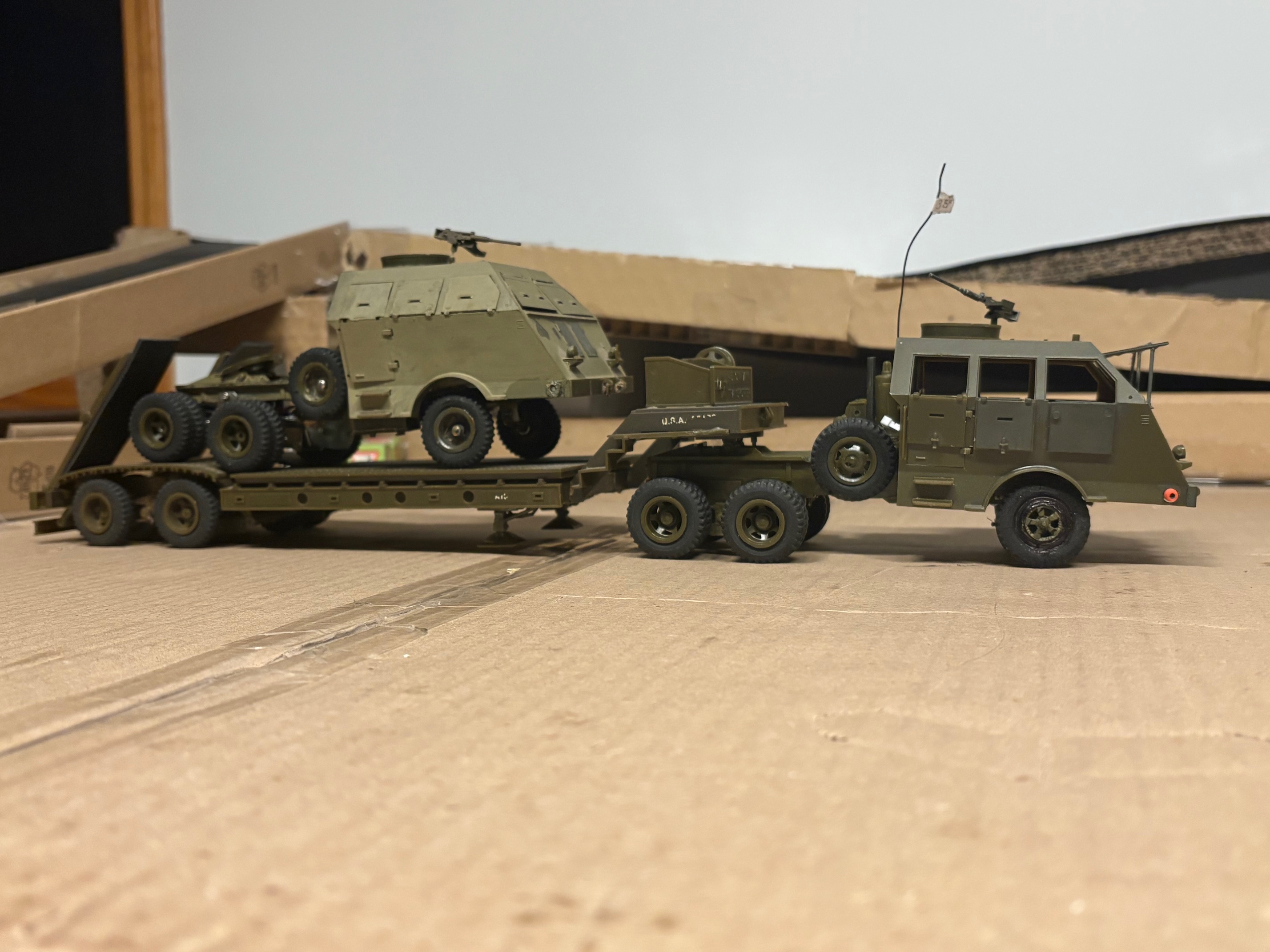 Don't see this too often. Two RC Peerless MAX trucks, one hauling the other. The one in front has the factory stance which I think is too low in the front. The spare tire on these trucks is actually a motor on\off switch in the factory setup up. The truck in front has a 72 mHz ch 35 RC aircraft radio receiver that works perfect. These trucks had plastic wheels on the front and were changed over to rubber tires like on the rear axles.