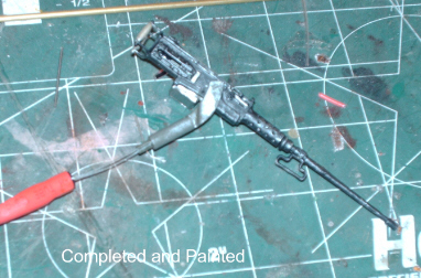 Drill a hole in the mount and feed the Optic Fibers through, then secure in the tube so so ends ofthe fibers sit on top of the  LED.  Putty up the cut area of the barrel. Sand and paint!