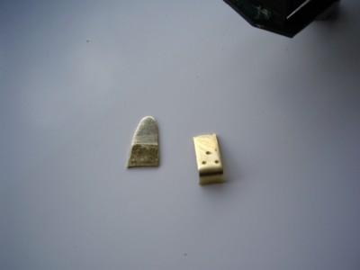 more brass this time the blade sight and a thingy that sits on the turret roof sorry no idea what it is?