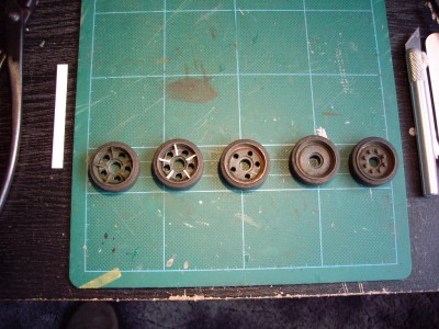 this shows the five steps that go to make each wheel the round holes are squared and then the fins are added,, do this twelve times ,,i found that making about one a day was enough..