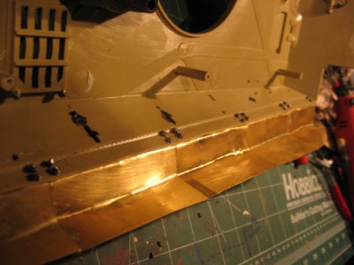 trimmed off excess track guard bolt length with cutting pliers then dremmel sharp tip. superglued nuts. Not completely tight so some panels move a little...more realistic. you have to grind down the mato hull posts about 3mm each so the hull fits flush.
