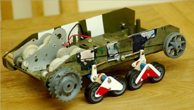 Suspension units made and fitted. They are constructed from Pzr III wheels, air tubing, thick, strip balsa and plastic sheet. The axels are made from the stainless steal posts that are used on HL gear box's. You can also see that the sides of the gear box's have been shaved right down to give me a lower profile.