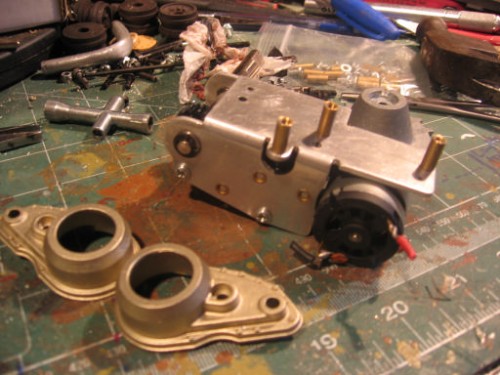 Brass standoffs on asiatam motors and Schumo final drive covers (real nice items..come with rubber covered guide wheel). you will have to drill some new holes. BE careful not to put your mount in the way of the torsion bars!!