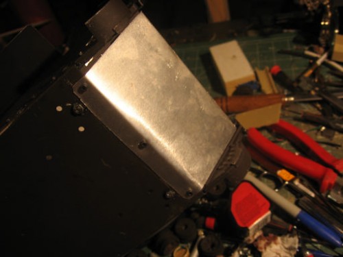 little 2.5mm screws and nuts will be ground down a bit.