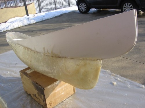 ABS flexible enough to pry down and seperate the sides and then the front popped up..