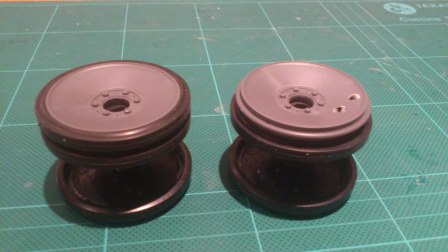 Both rear road wheels after outer hubs have been replaced with Tamiya parts - one tyre is left off to represent battle damage.jpg