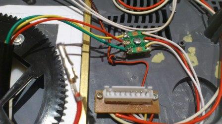Above are the 3 wires from the recoil unit attached to the square board. Below (sticking up) the stray wire which needs to be grounded.JPG
