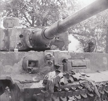 Nice close-up of battle damage to Tiger 211 of s.SS-Pz.Abt.101. It shows how much these beasts could endure, although this was enough to stop the tank and kill some of the crew.jpg