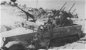 m16 halftrack with extra 50 cal mounted above windshield posibbly near the Reamegen bridgehead. A ww2 photo
