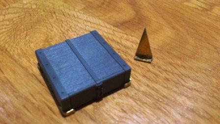 Tamiya jack block with added brass corner mounts beside the triangular support for the headlight bracket.jpg