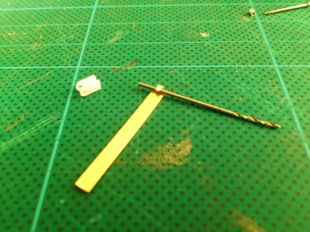 For the clamp itself the end of a brass strip was filed narrower, then bent around a drill bit.jpg