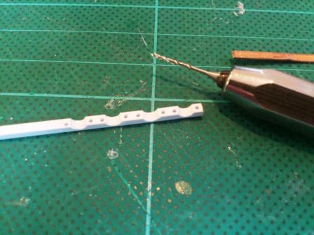 Next I drilled holes for each end of the clamps.jpg