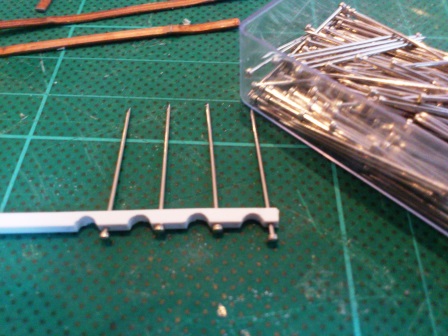 Dress making pins were then inserted into one end of each clamp.jpg