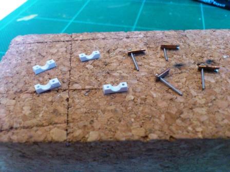 Now separated, the pins were then cut shorter and each staple segment had a notch cut into one end.jpg