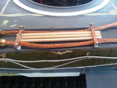 The central cable and gun barrel cleaning rod brackets installed with Schumo butterfly nuts and temporary rods from toothpicks.jpg