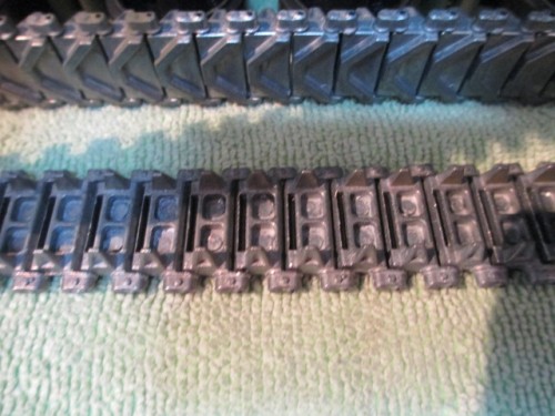 Took the tracks off by removing the Sprocket  It was easy and I was able to get a close look at the hollow track pads