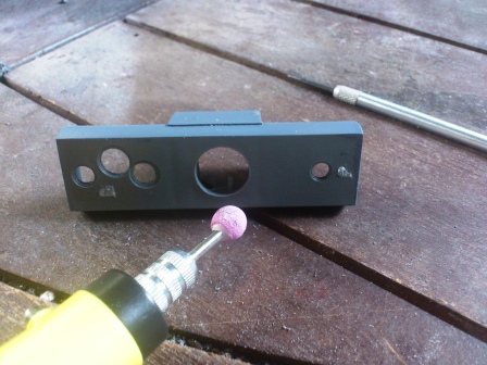 View of the same piece from the front - to enlarge the relocated hole I used my trusty rotary tool.jpg