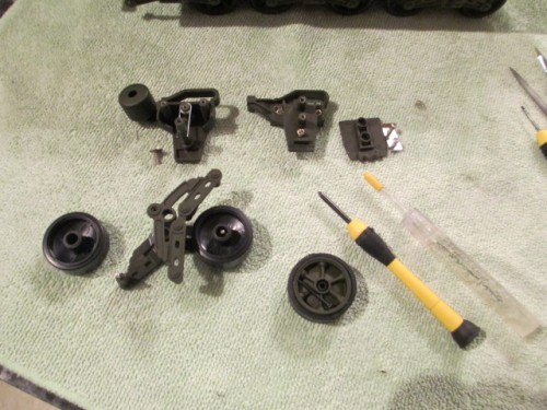 Disassembled Mato bogie to remove the road wheels