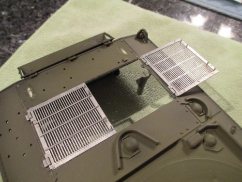 Holes drilled and grills mounted with hinges glued into place