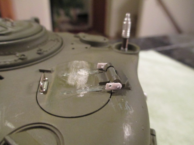 Hinge mount hook tabs installed