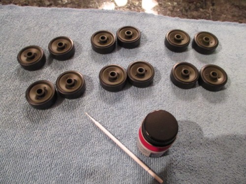 Six sets of road wheels, Insignia Red and a mini brush