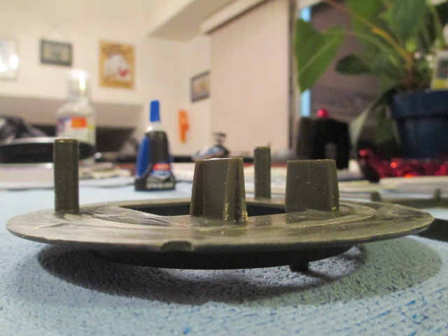 Five minutes of careful sawing and 30+ minutes of medium to fine plastic removal and smoothing yield the desired flat surface.