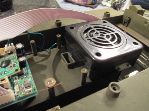 New speaker mounted with a screw and tab + a section of removable double stick for cushioning.  Note the aerial screw safeguard