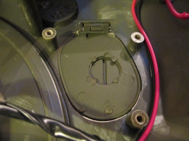 Undo three screws and remove the molded insert.