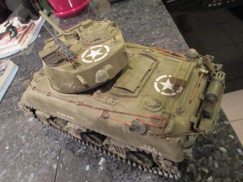 A few bits of stowage, some gas, rations and an oil can as well as extra mg ammo in both calibers