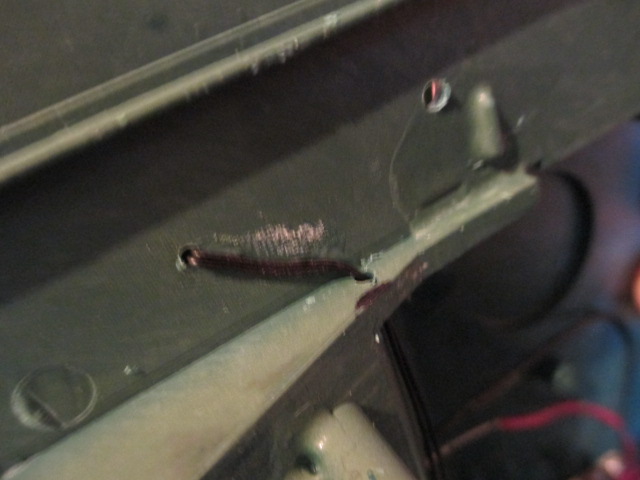 Wires laced through and glued into place.  Since these are right above the tracks, I added a tape section over them.