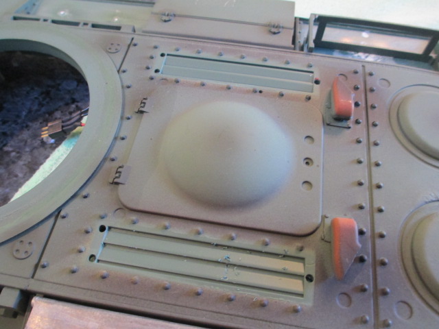The under grill engine air intake louvers.  They can be cut out and set to open on the HL KV-2 but it is not recommended on the Taigen version due to the under deck mounted Smoker