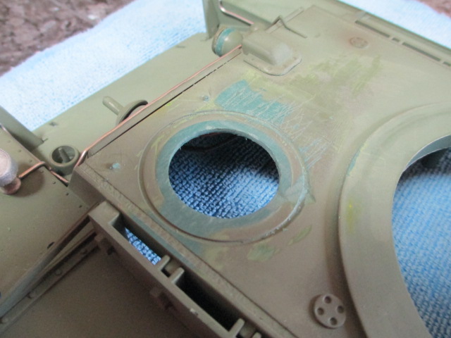 Remnant of the hatch roughly removed with a dremel and flat file.